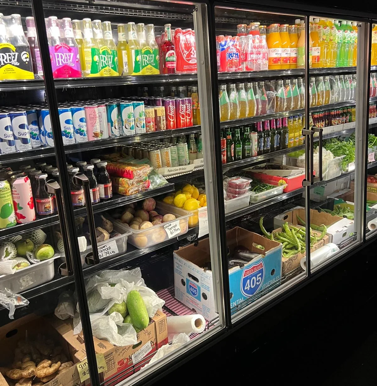 Fresh produce and bottled drinks in the Sidra Market coolers