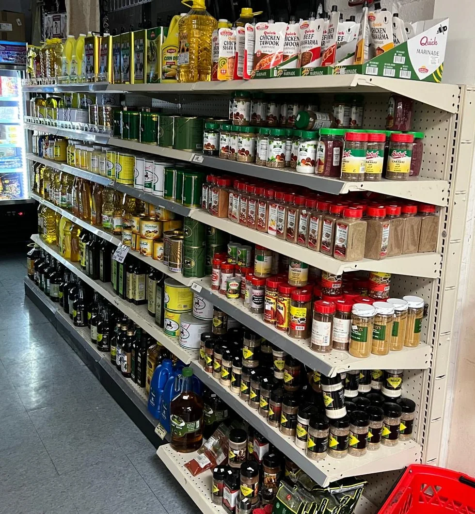 Sidra shelves stocked with spices, cooking oils and marinades